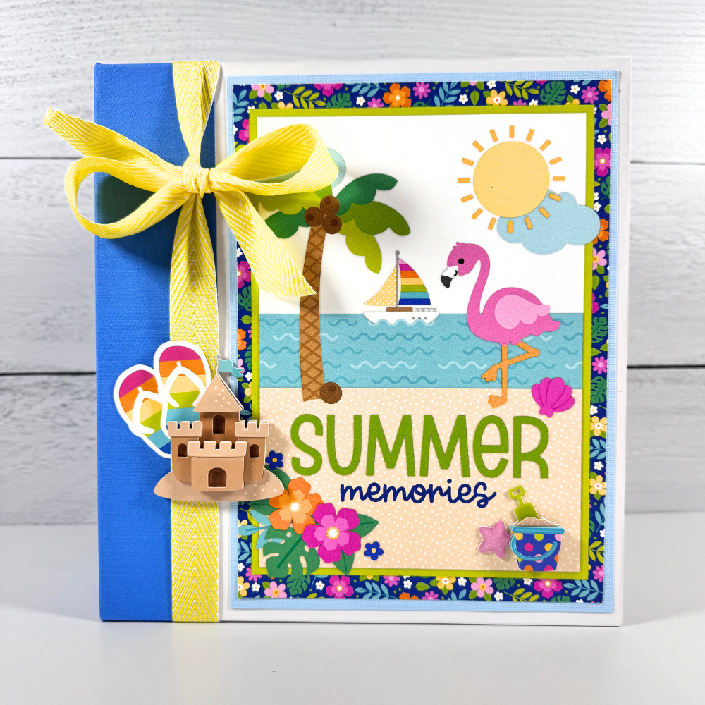 Summer Memories Scrapbook Album with a beach scene, flamingo, palm tree, sand castle, sailboat, and tropical flowers