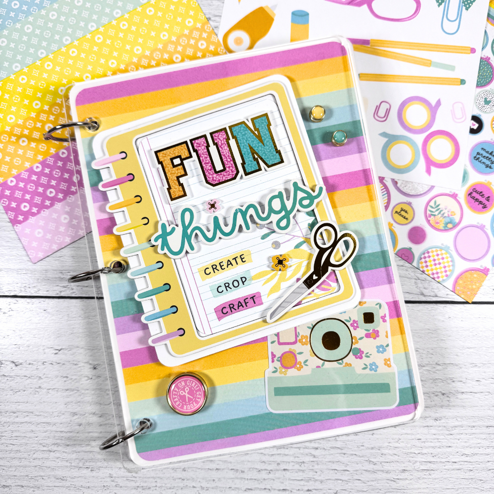 Crafty Fun Things Scrapbook Album with colorful stripes, a camera, and crafting supplies
