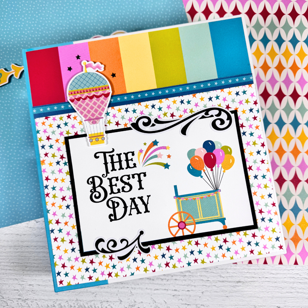 The Best Day Scrapbook Album with bright fun colors, stars, balloons, stripes, and fireworks