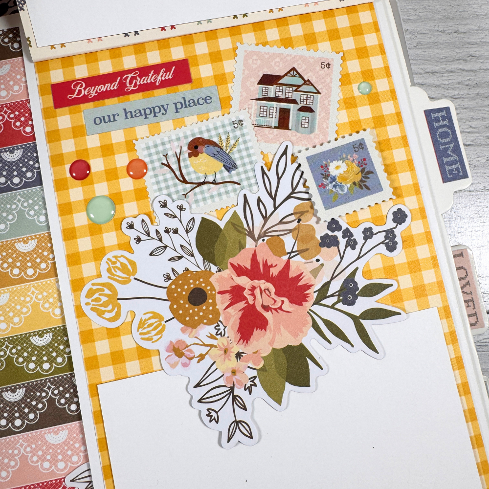 Memories Scrapbook Mini Album Page with flowers, stamps, enamel dots, and a folding card