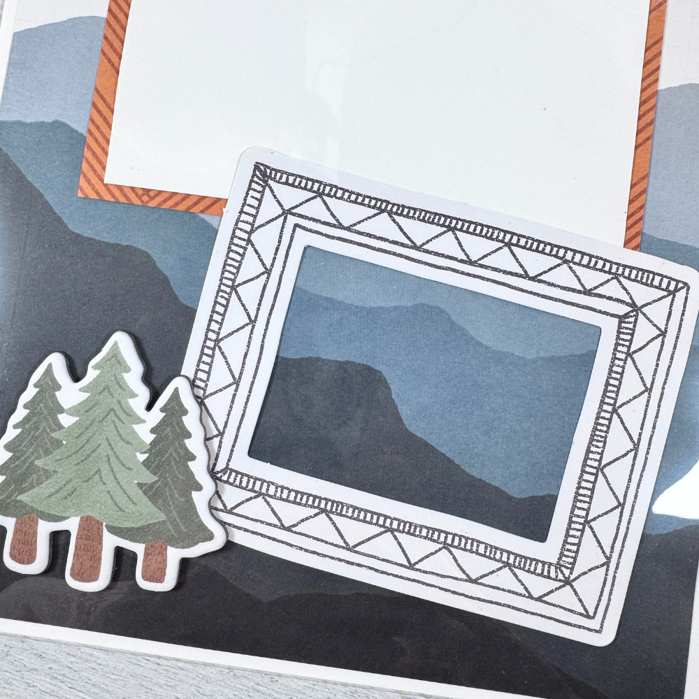 Say Hello To New Adventure Mini Scrapbook Page with mountains, trees, and a picture frame