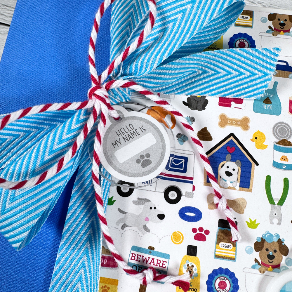 Life is Better With a Dog Scrapbook Album with a bow, twine, and an acrylic dog tag charm