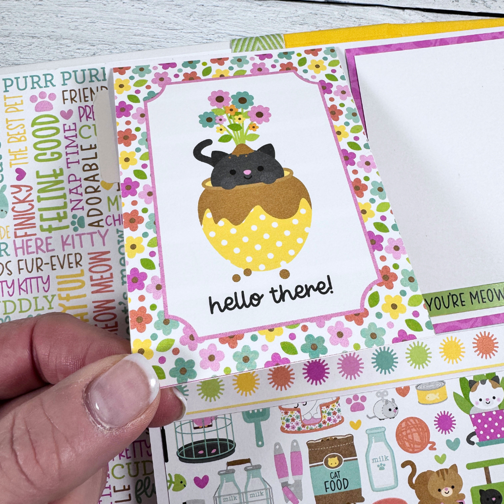 Cat Scrapbook Album page with a folding card, flowers, and lots of cute pet supplies