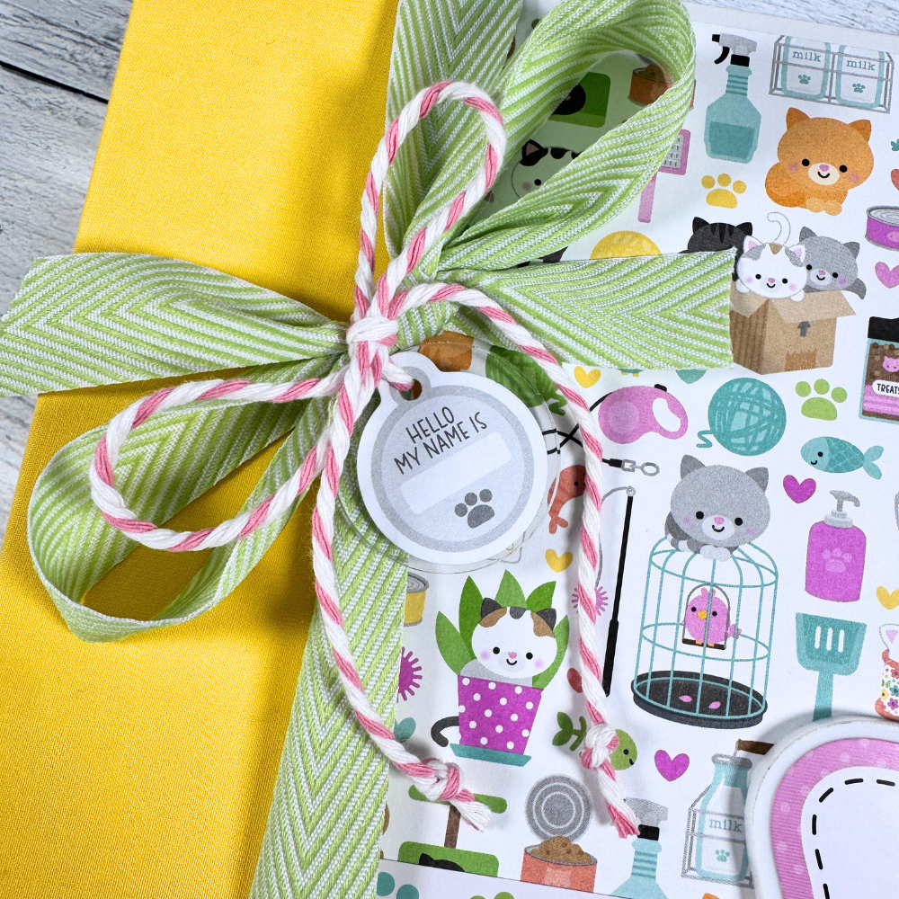 Life is Better With a Cat Scrapbook Album with a bow, twine, and an acrylic cat tag charm