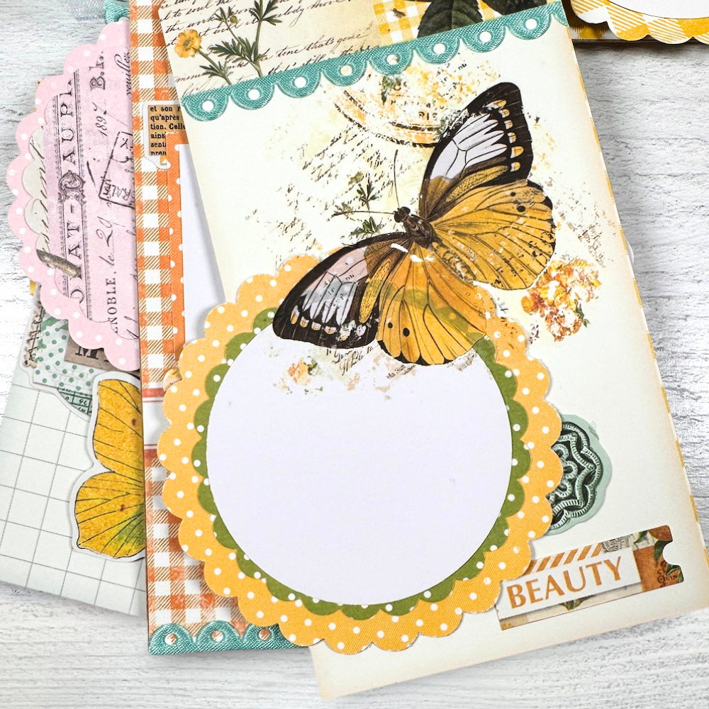 Spring Tag Shaped Mini Album Page with a pretty yellow butterfly, a scalloped circle photo mat, and a scallop aqua ribbon