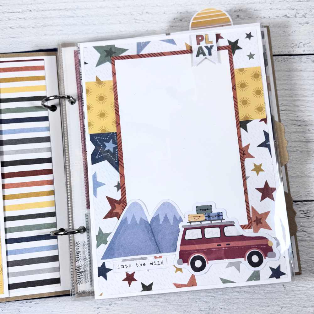 Say Hello To New Adventure Mini Scrapbook Page with mountains, stars, and a car with luggage on top