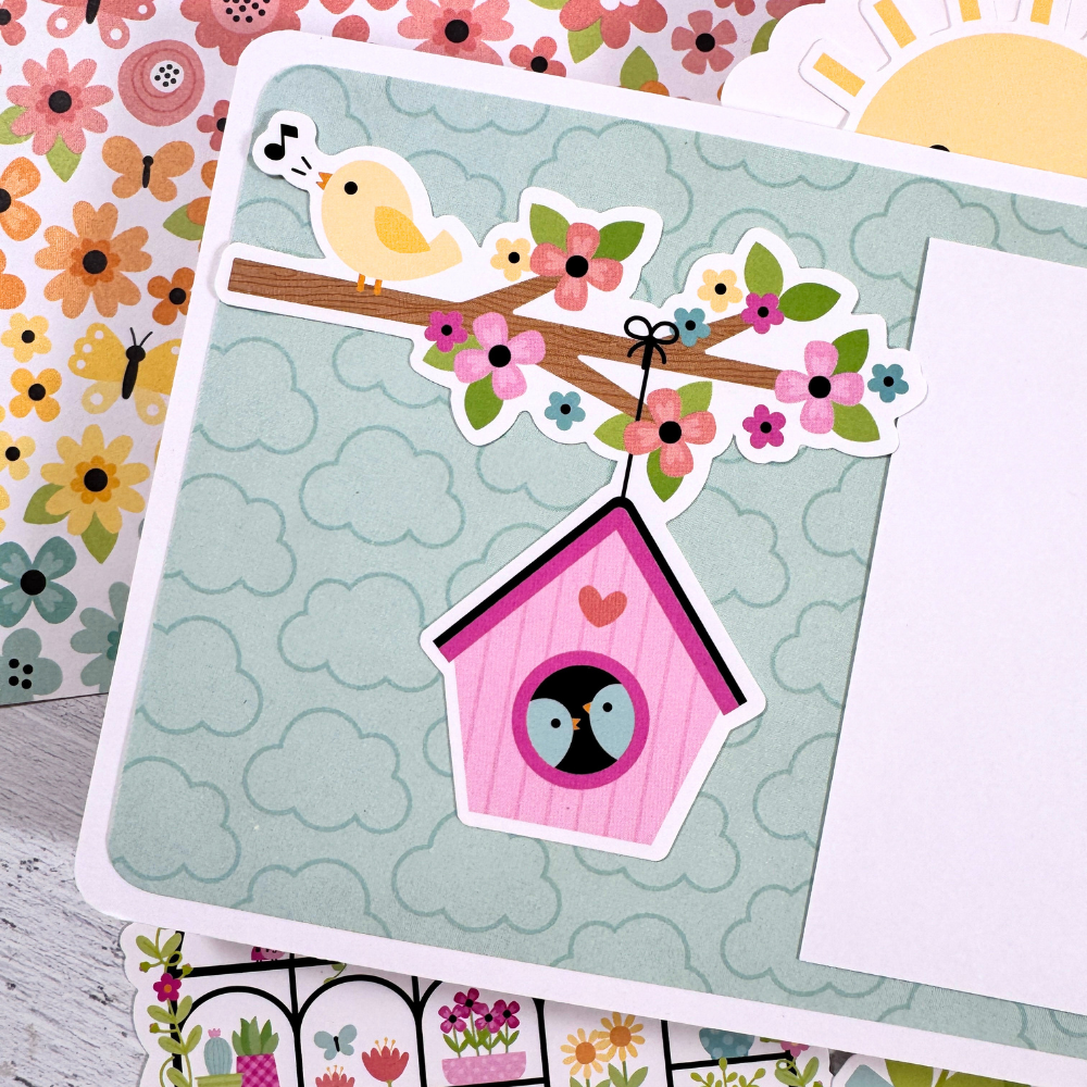 Happy Memories Scrapbook Mini Album Page with spring flowers, birds, and a bird house