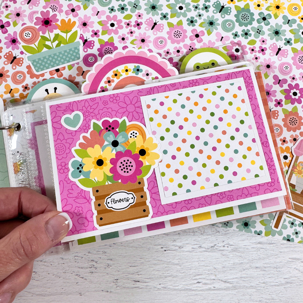 Happy Memories Scrapbook Mini Album Page with a folding element, spring flowers, a rainbow, and colorful polka dots