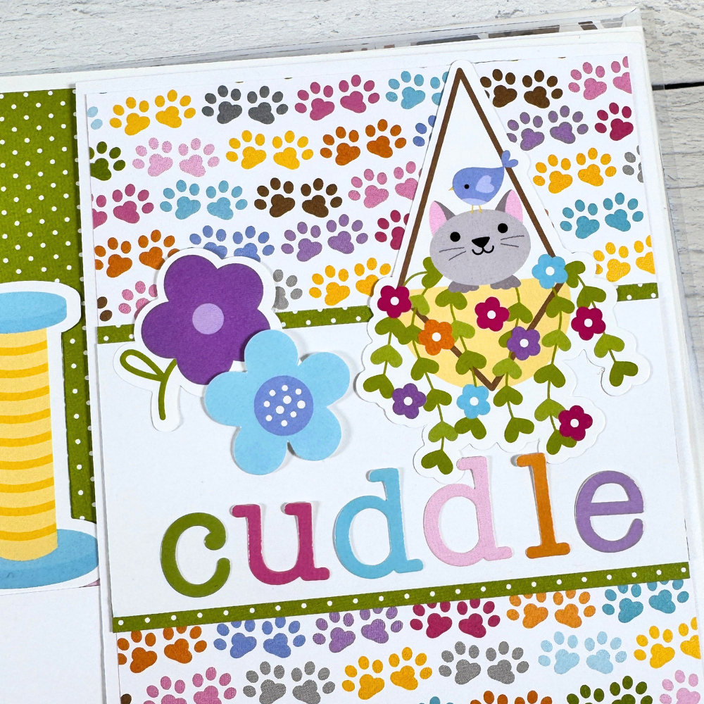 Cat Meow Scrapbook Mini Album Page with colorful pawprints, flowers, and a cute kitty in a hanging basket