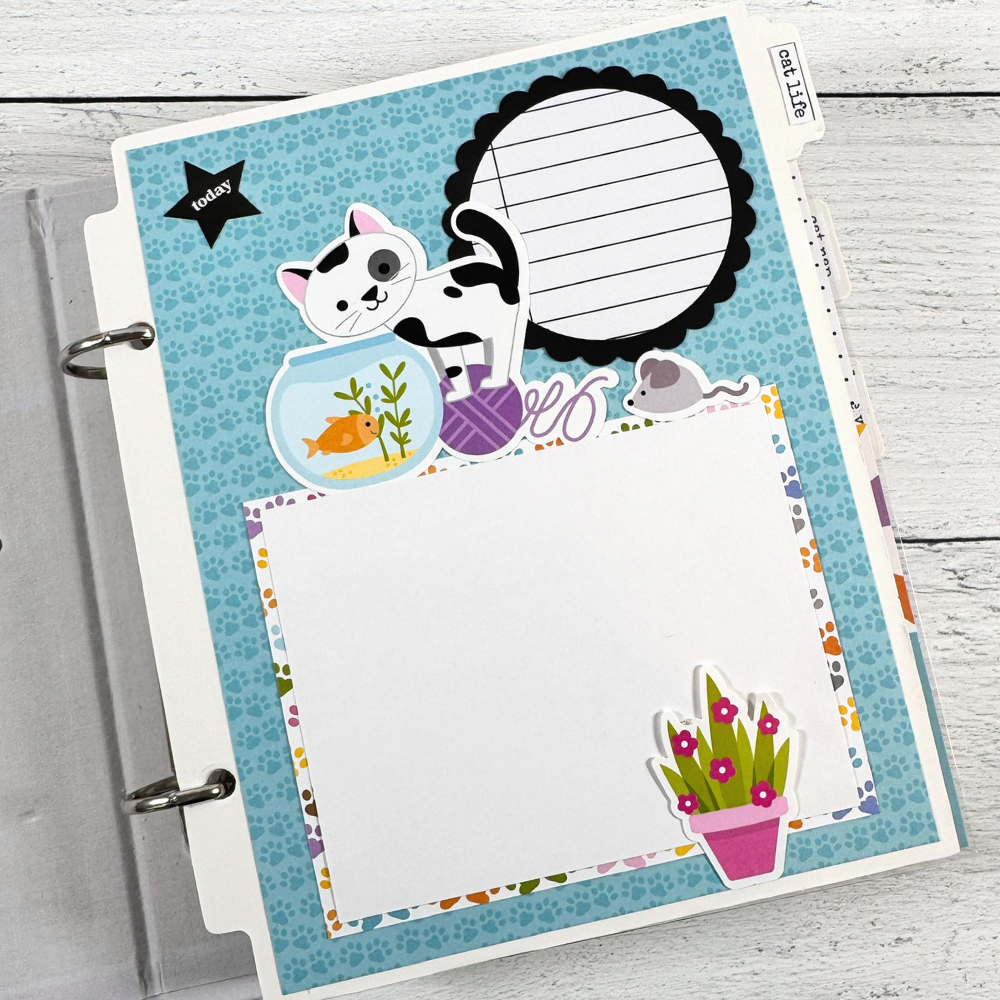Cat Meow Scrapbook Mini Album Page with a cat, a fish bowl, yarn, a photo mat, and a scalloped circle journaling spot