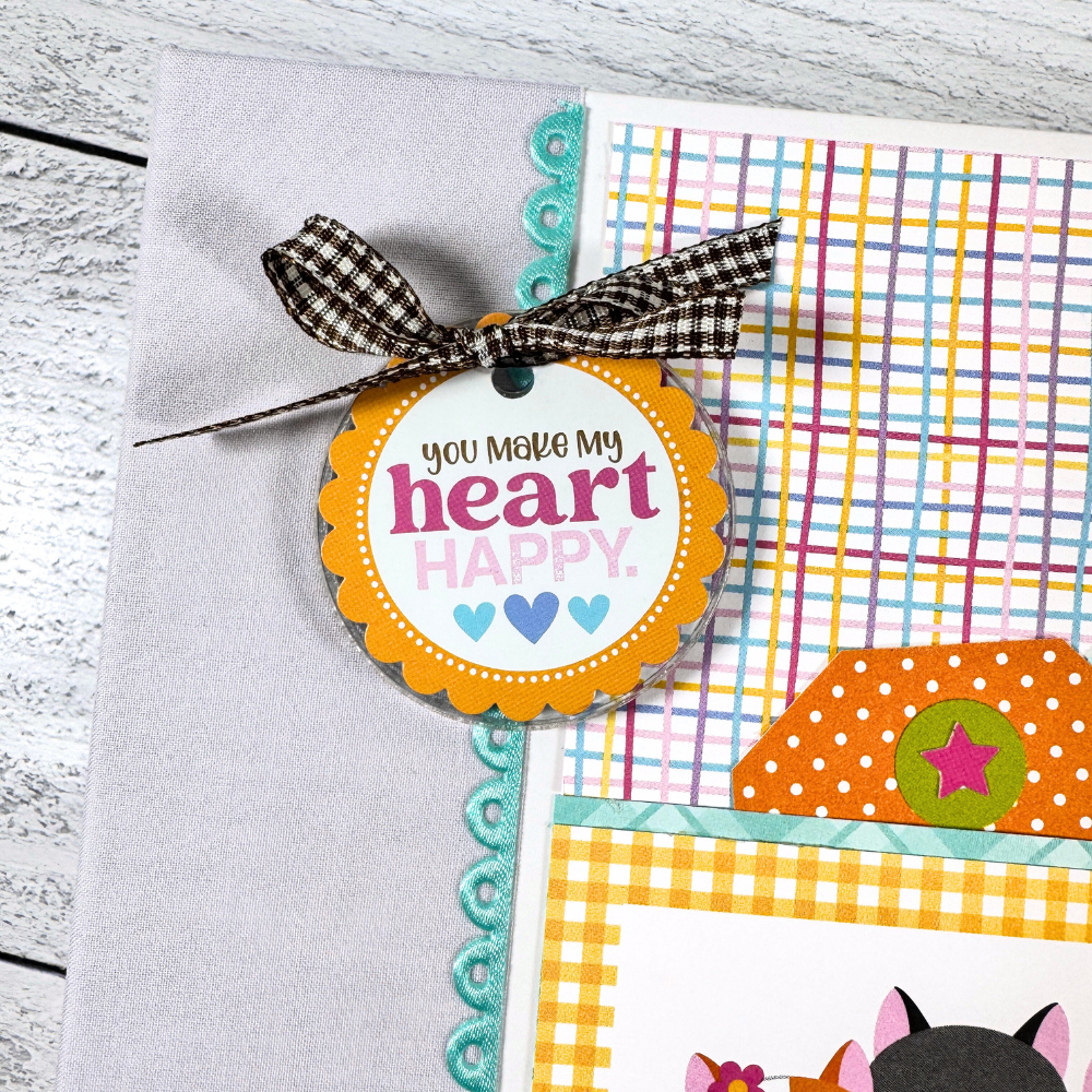 Cat Meow Scrapbook Mini Album with cats, paw prints, tags, a scalloped ribbon, a charm, and a bow
