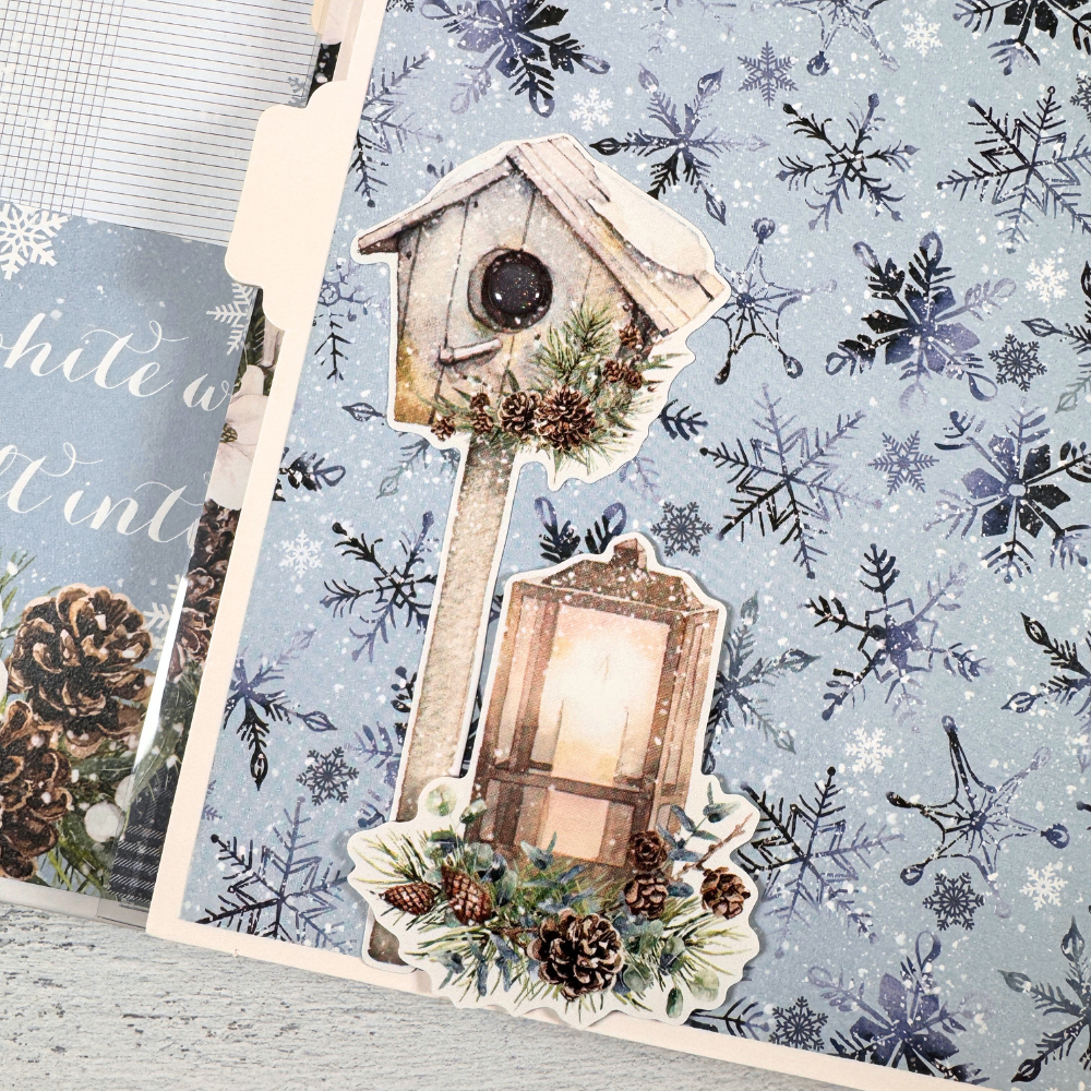 Chasing Snowflakes Winter Scrapbook Album Page with a birdhouse, a lantern, and pinecones