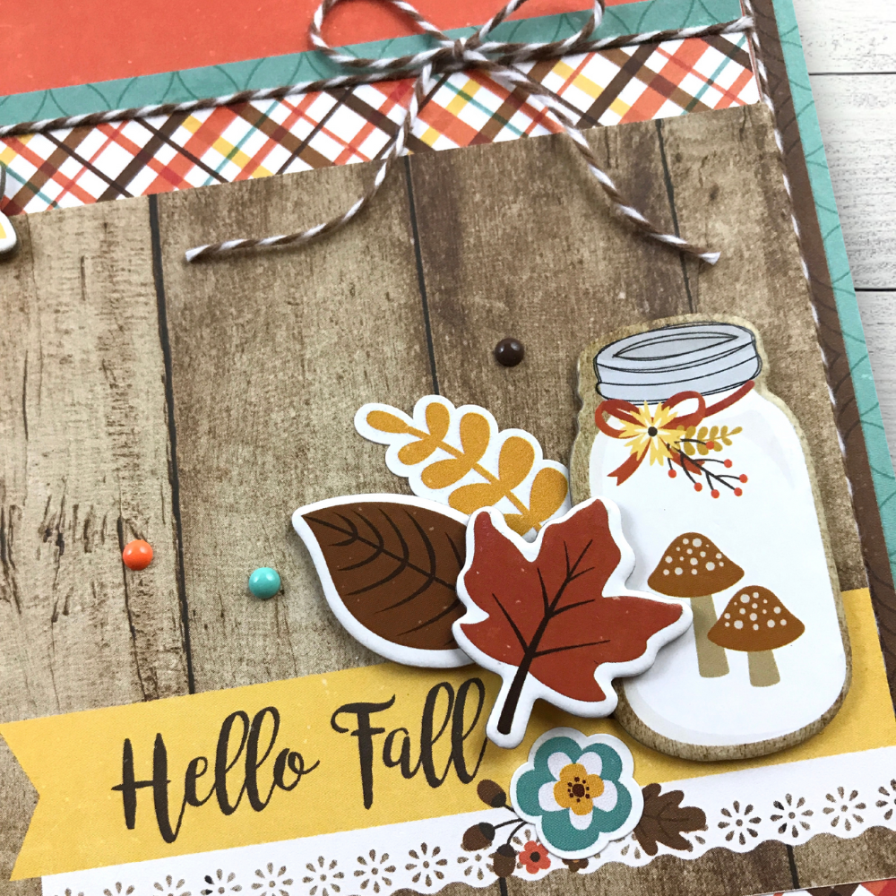 Hello Fall Perfect Autumn Scrapbook Album with a bird, leaves, a jar, mushrooms, and a bow