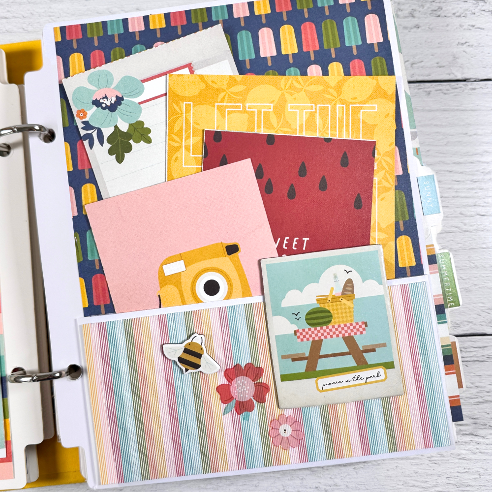 Sunny Days Summer Scrapbook Album Page with a pocket, journaling cards, flowers, a bee, a picnic table, and colorful Popsicles