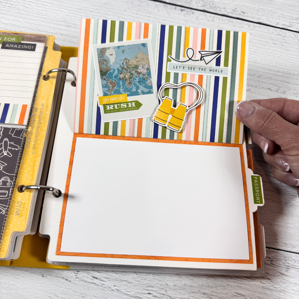 Travel Vibes Scrapbook Mini Album page with colorful stripes, a folding card, a Polaroid, a map, and binoculars