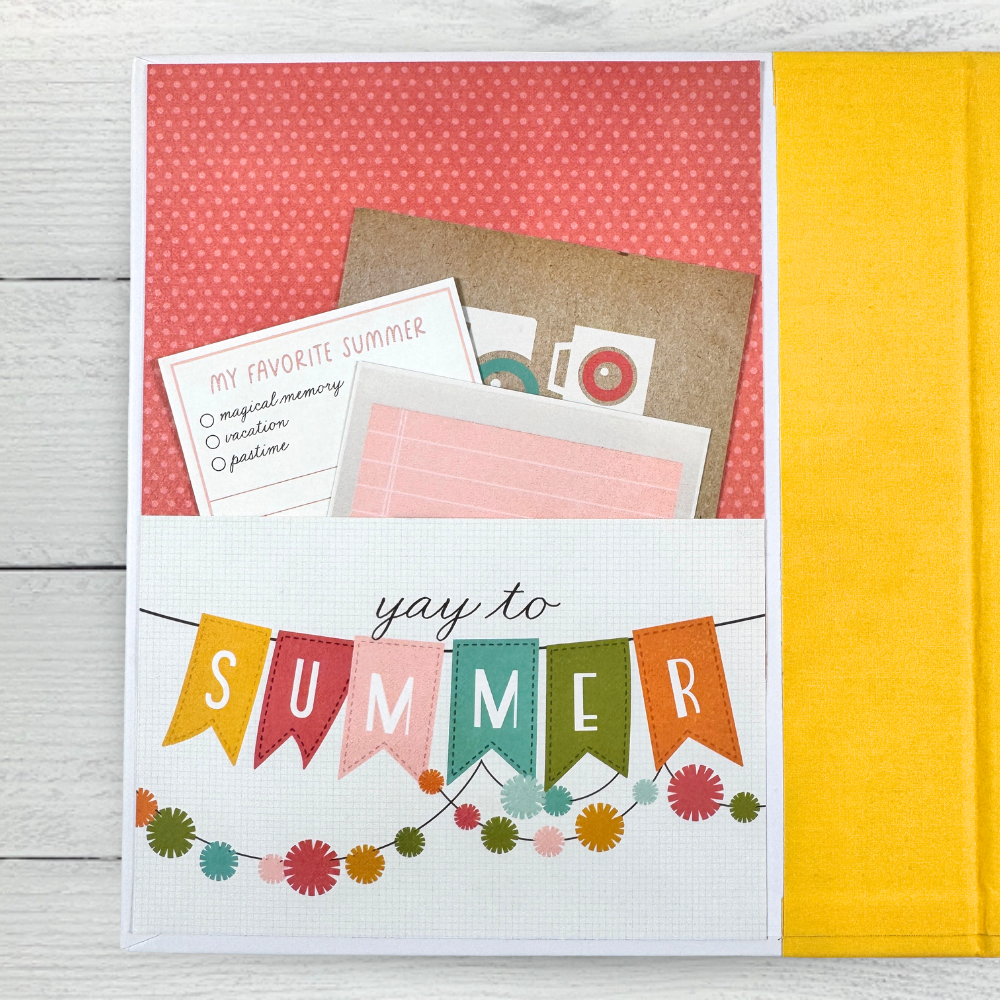 Sunny Days Summer Scrapbook Album Page with a banner, garland, a pocket, and journaling cards