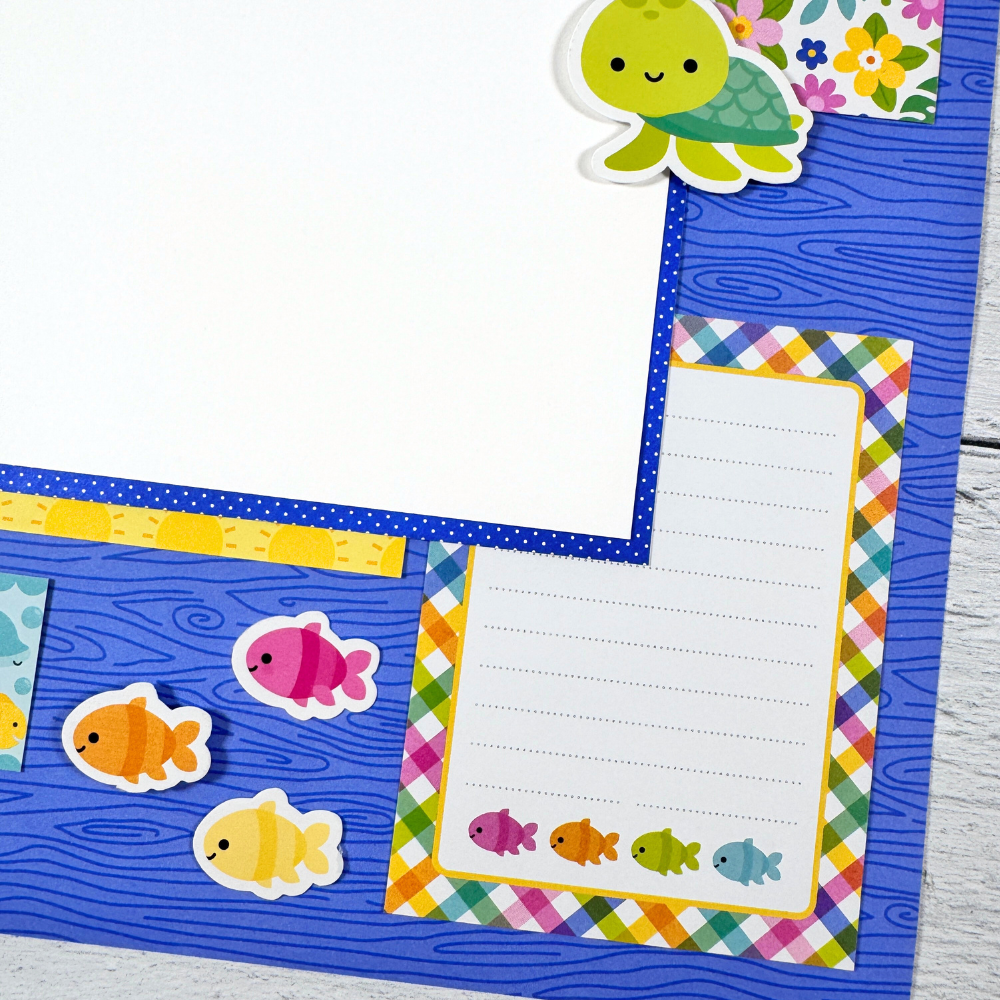 12x12 Living the Dream Summer Scrapbook Page Layout with a cute turtle, colorful fish, and a pretty plaid journaling card