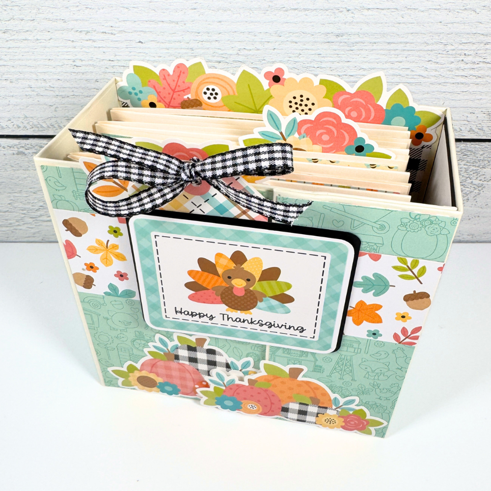 Thanksgiving Scrapbook Mini Album with a turkey, fall leaves, colorful flowers, pumpkins, and acorns