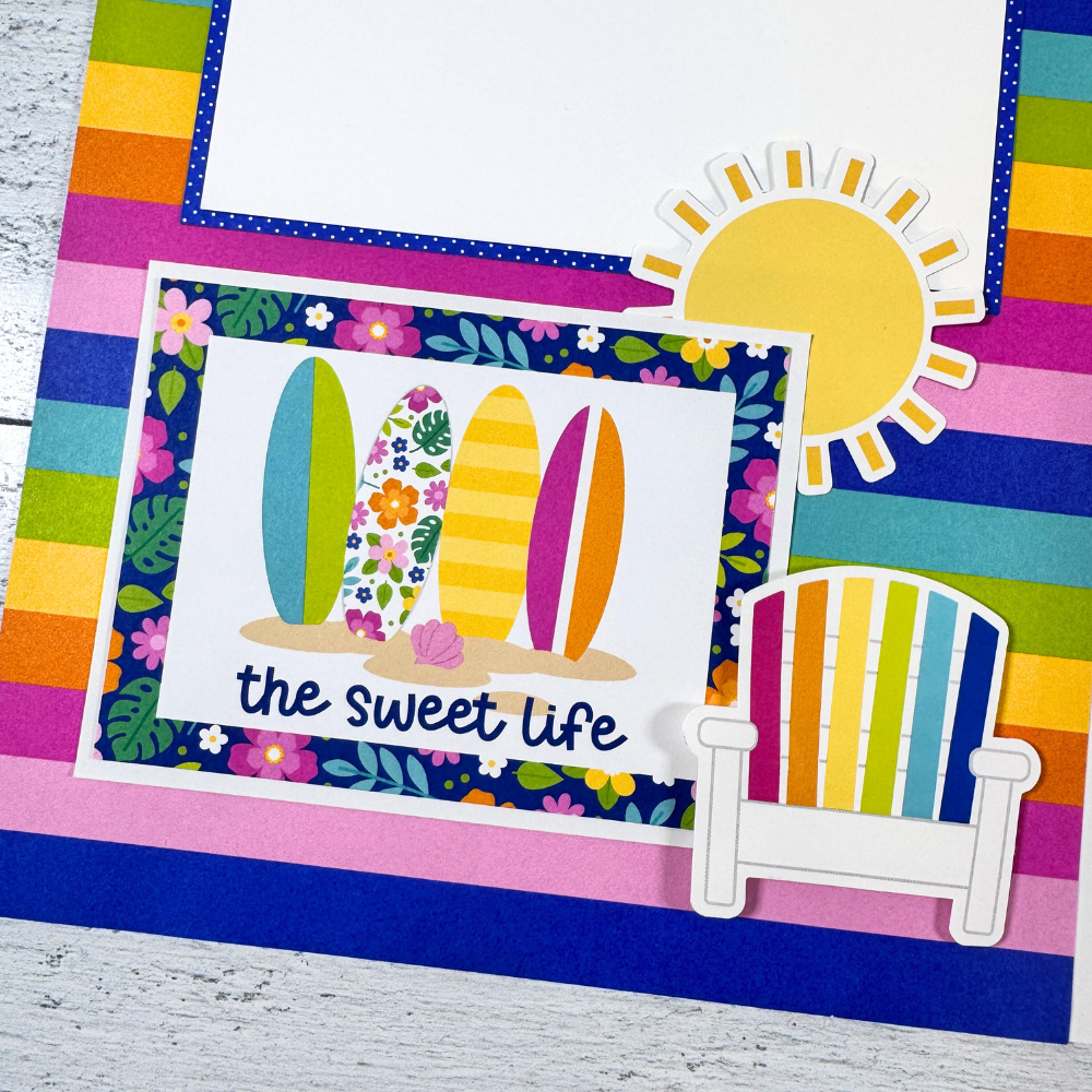 12x12 Living the Dream Summer Scrapbook Page Layout with a sun, surfboards, flowers, and rainbow colors