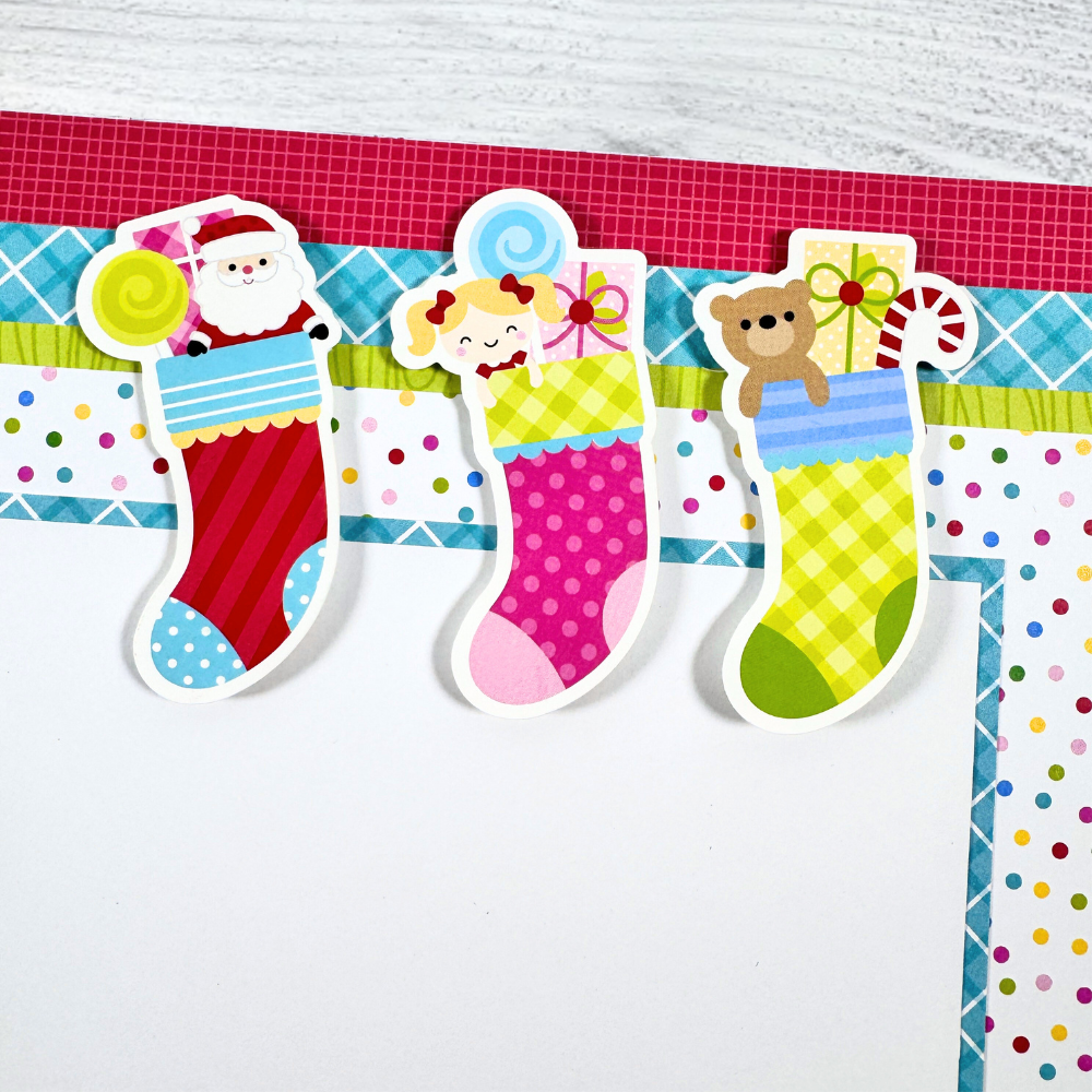 12x12 Oh What Fun Christmas Scrapbook Layout with stockings, toys, Santa, candy, and colorful polka dots