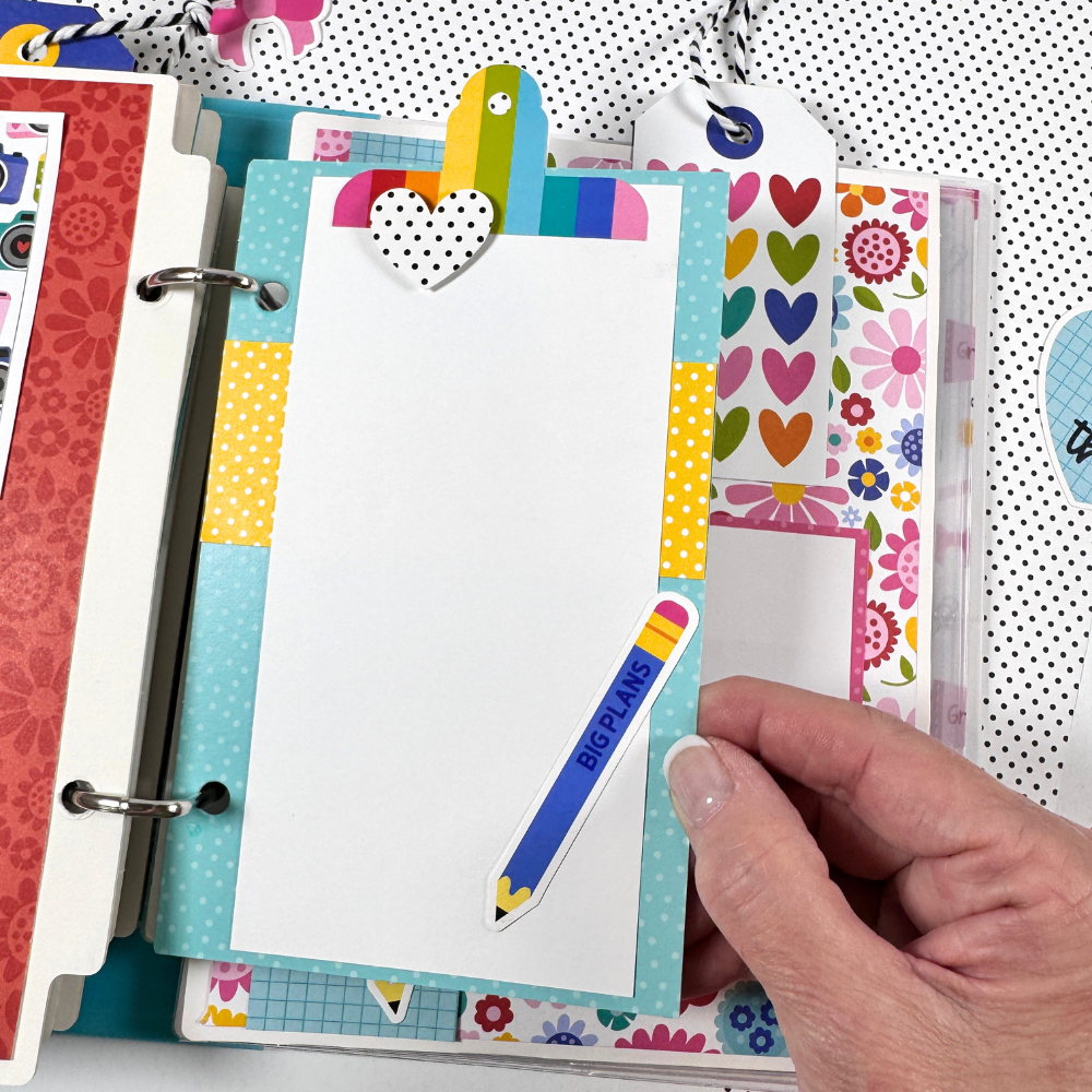 Documented Scrapbook Mini Album Page with bright colors, flowers, hearts, a pencil, and a photo mat