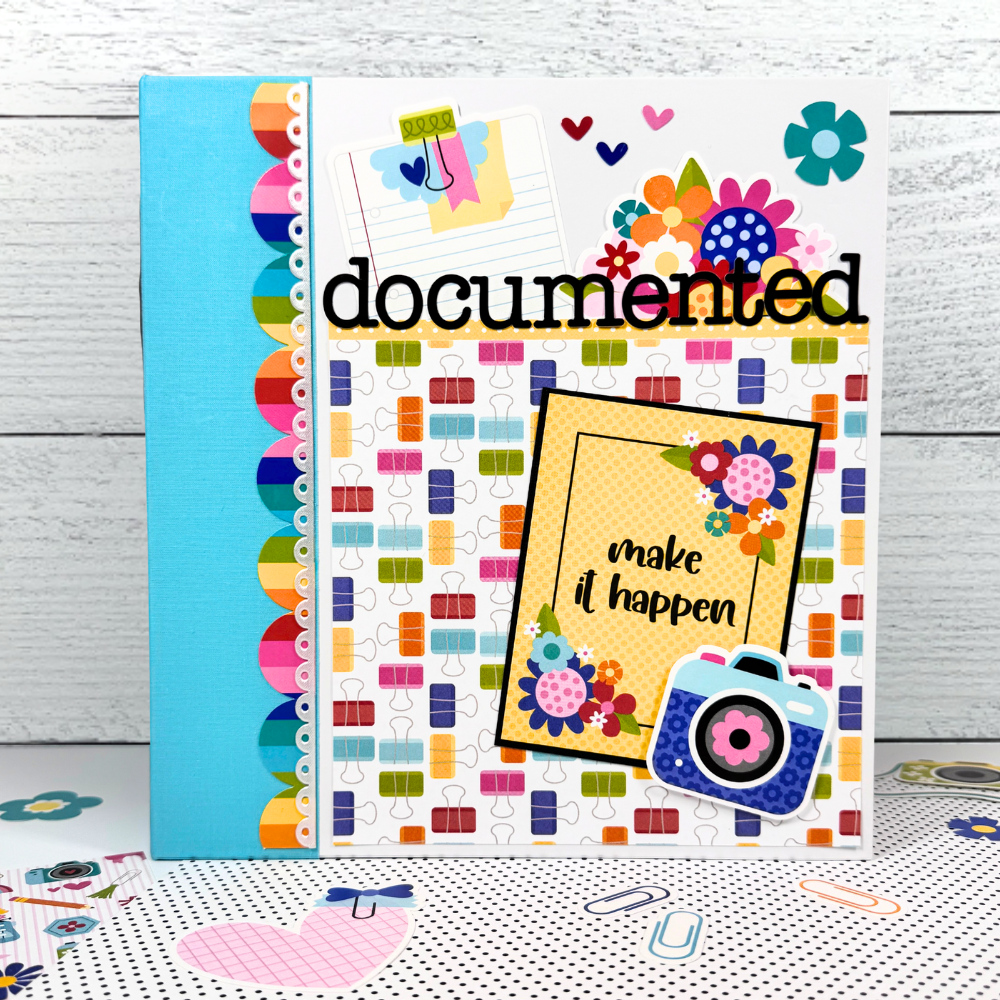 Documented Scrapbook Mini Album with bright colors, flowers, cameras, office supplies, and fun pattern papers