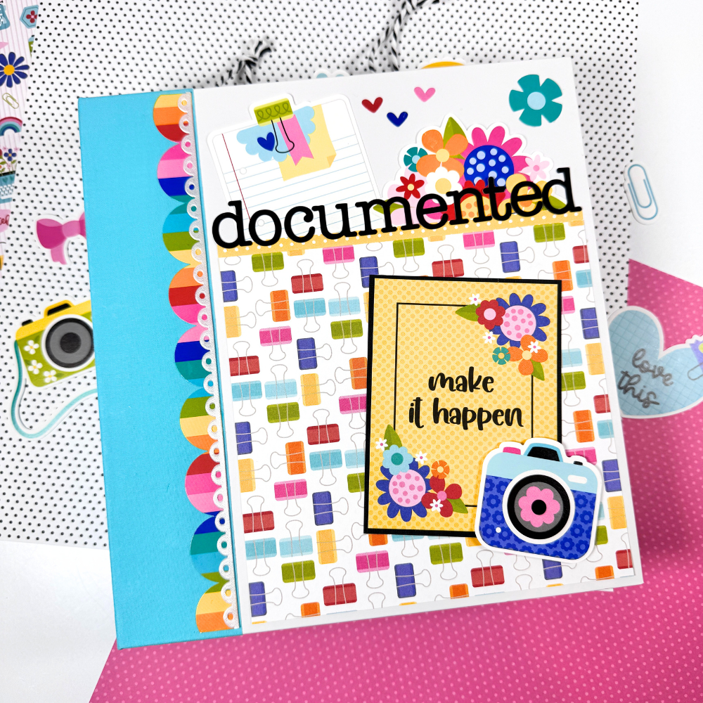 Documented Scrapbook Mini Album with bright colors, flowers, cameras, office supplies, and fun pattern papers