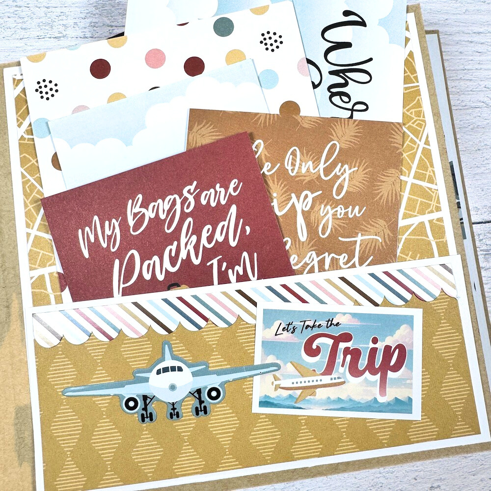 Travel The World With Me Scrapbook Album page with an airplane, a pocket, and journaling cards