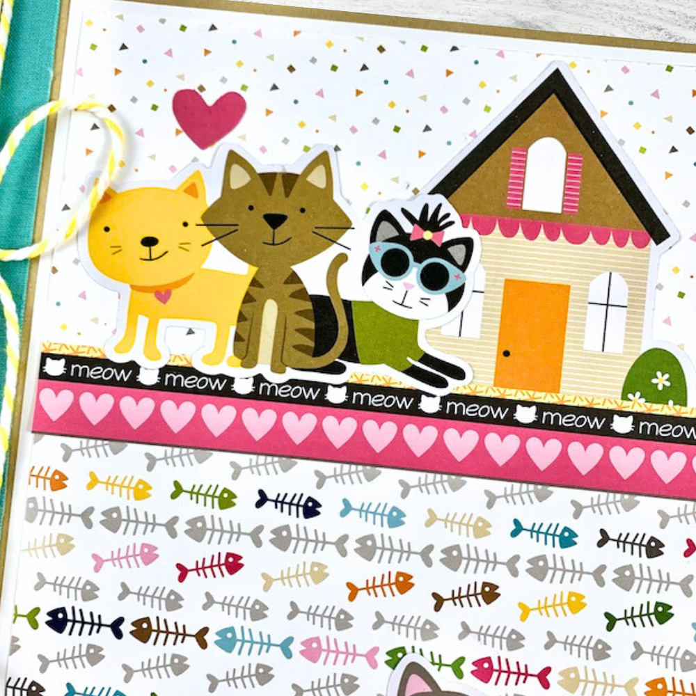 Cat Meow Scrapbook Mini Album with kitty cats, a house, hearts, fish bones, paw prints, and toys