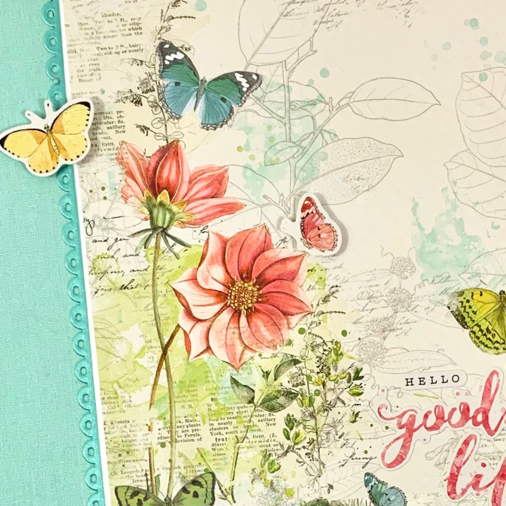 Good Life Spring Scrapbook Album with a scalloped ribbon, flowers, butterflies, & leaves