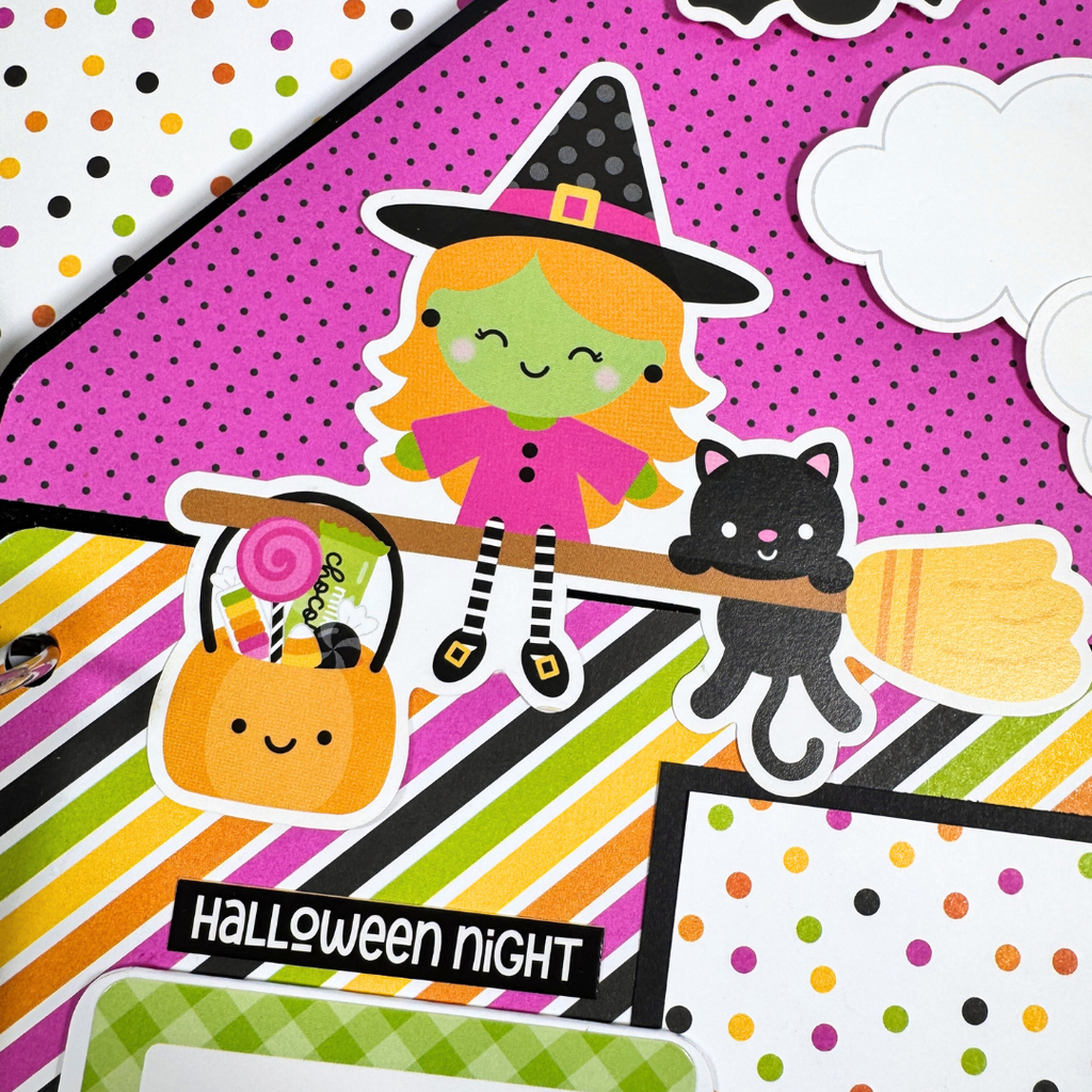 Halloween House Shaped Scrapbook Album Page with a cute witch on a broom, a pumpkin full of candy, a black cat, and colorful stripes and polka dots