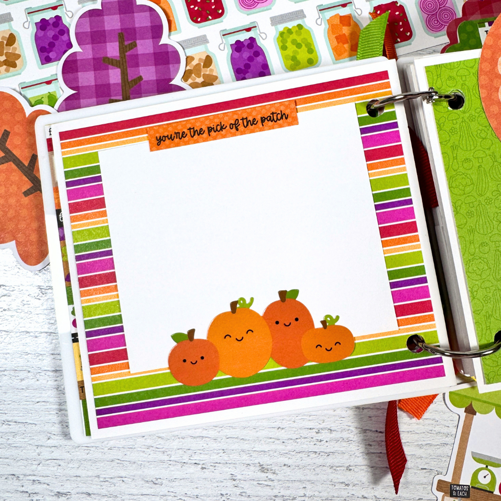Our Family Memories Fall Scrapbook Album Page with colorful stripes and cute pumpkins
