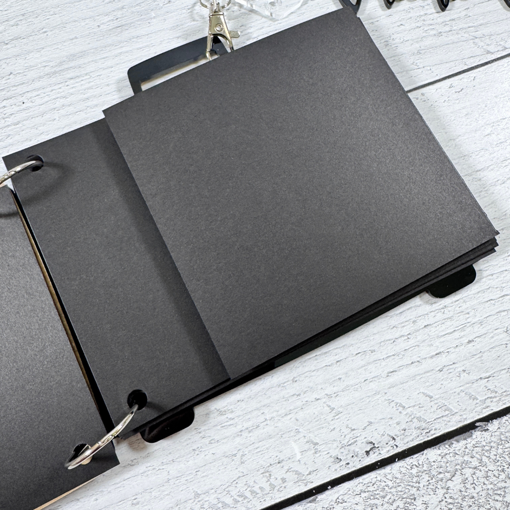 Acrylic Suitcase Shaped Scrapbook Album with a vacation title, clear luggage tag charm, binding rings, and card stock pages