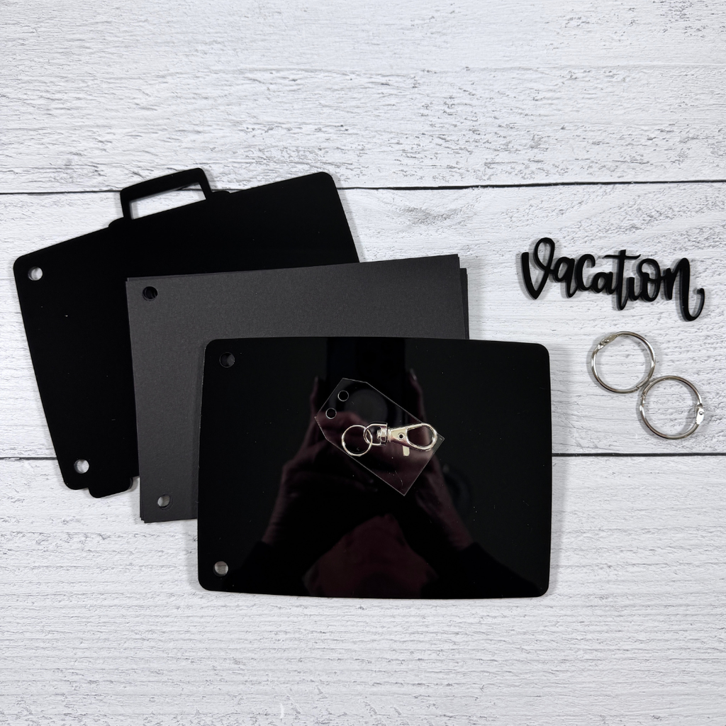 Acrylic Suitcase Shaped Scrapbook Album with a vacation title, clear luggage tag charm, binding rings, and card stock pages