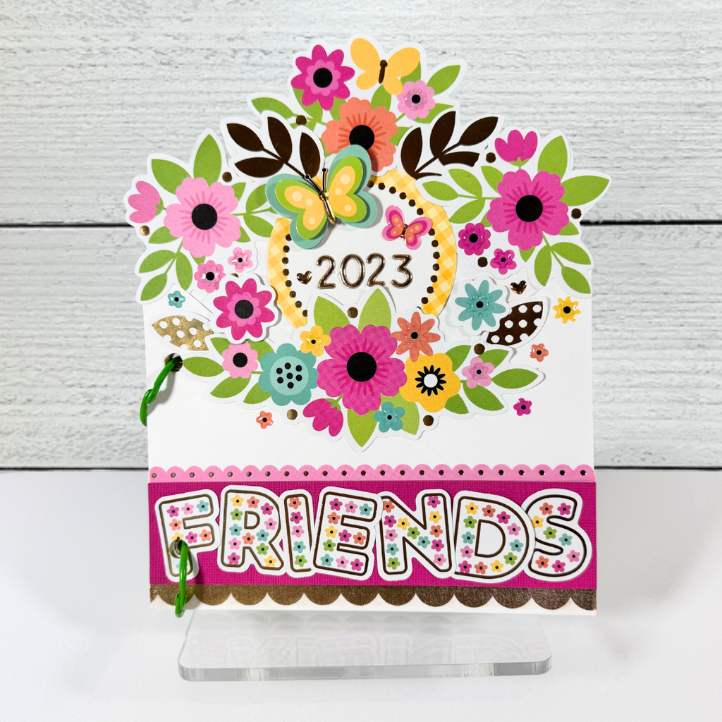 Friends Envelope Scrapbook Mini Album displayed on a clear acrylic stand