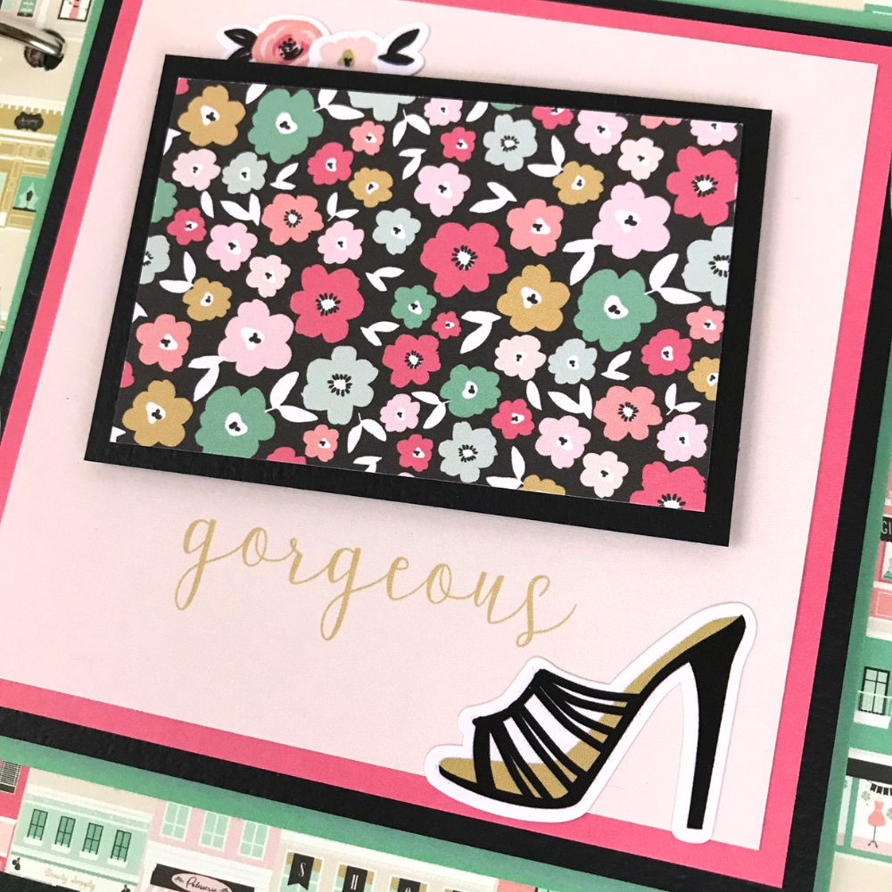 Fashionista Friend Scrapbook Album Page with flowers, a pretty shoe, and storefront paper in the background