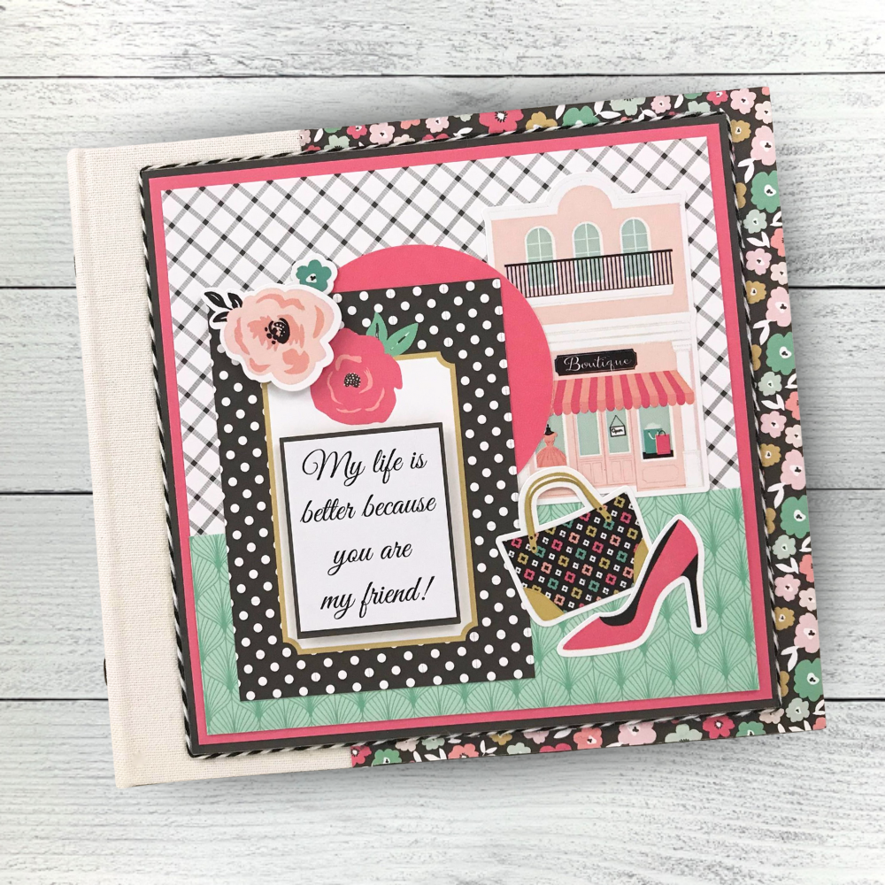 Fashionista Friend Scrapbook Album with flowers, a pretty shoe, and storefronts