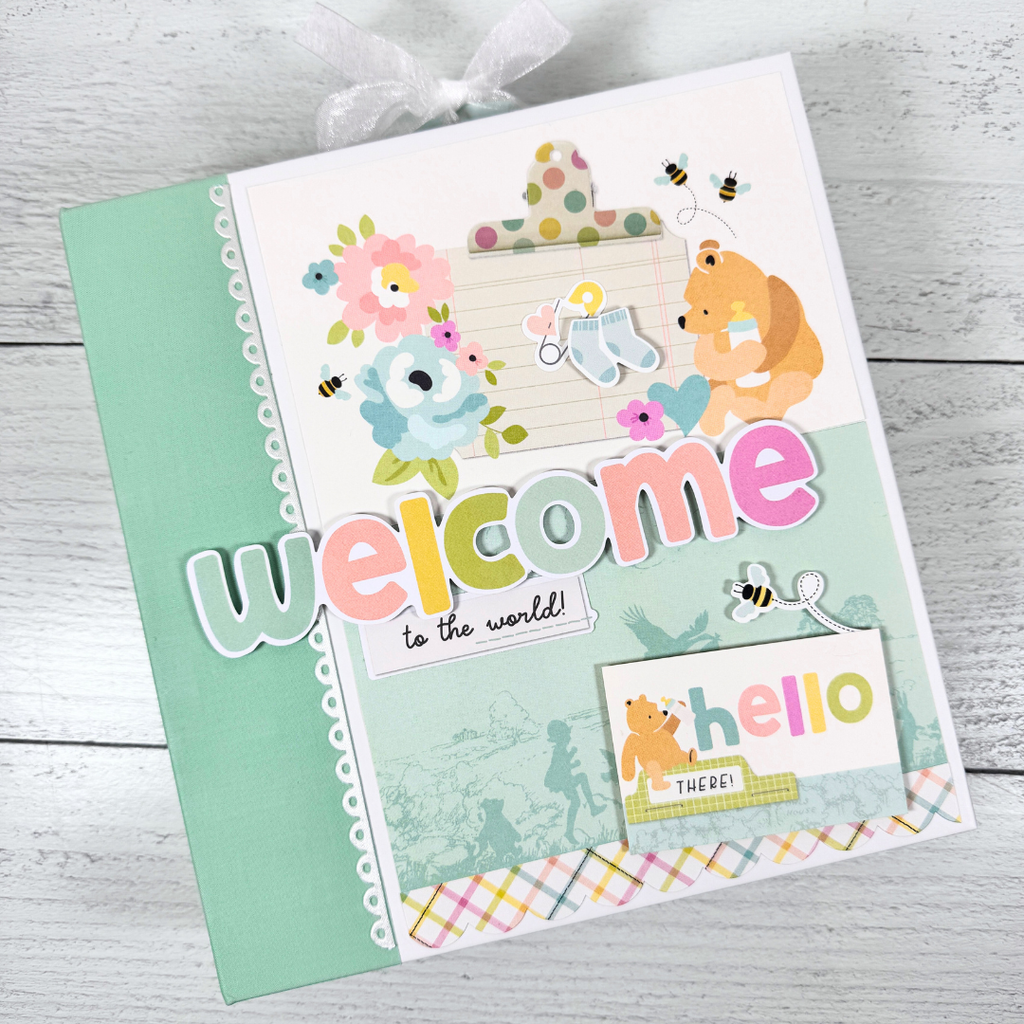 Winnie the Pooh Baby Scrapbook Album with bees, baby items, flowers, and soft colors