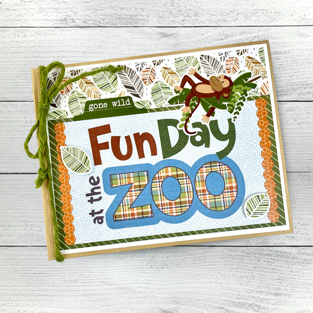 Fun Day at the Zoo Scrapbook Album with a jungle theme, monkeys, bears, giraffe, rhinos, tigers, elephants, and zebras