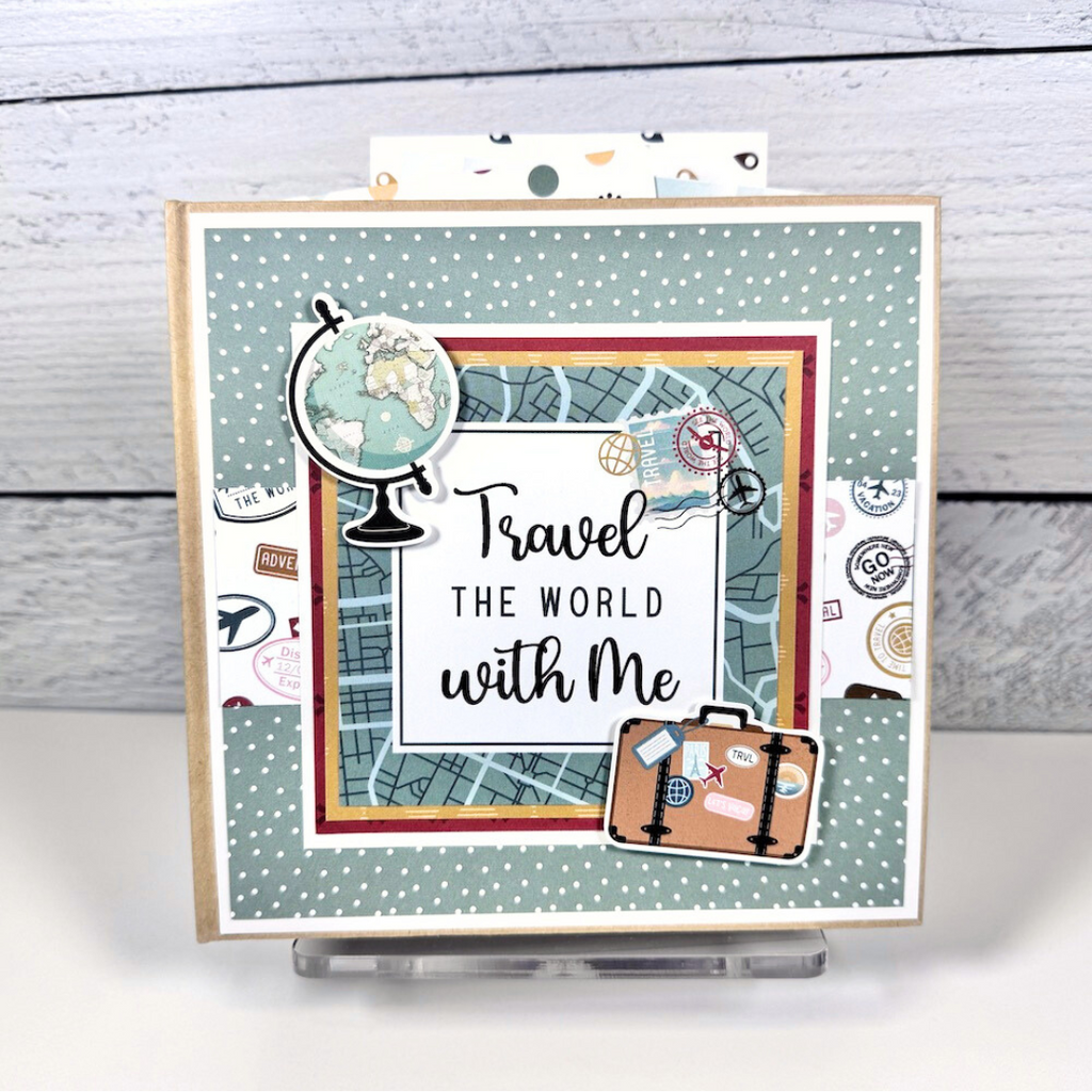 Travel The World With Me Scrapbook Album with map, globe, suitcase, and travel stamps