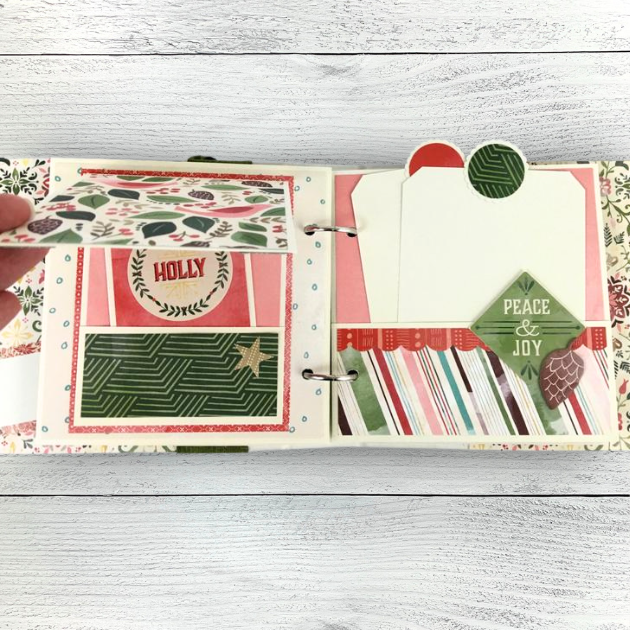 December 25 Christmas Scrapbook Mini Album pages with a folding card, leaves, and pockets with journaling cards