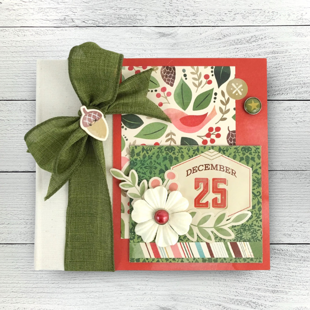 December 25 Christmas Scrapbook Mini Album with flowers, leaves, birds, and a big green bow