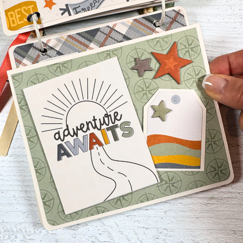 Adventure Scrapbook Mini Album Page with a sunshine, stars, and compasses