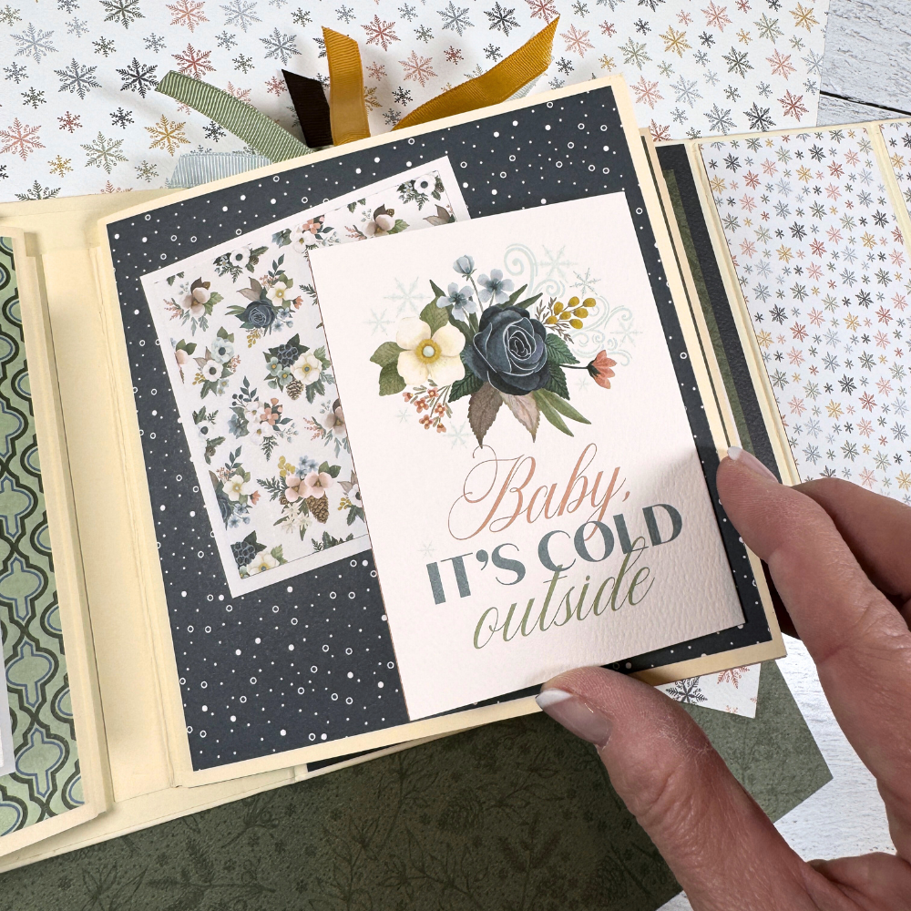 Let It Snow Scrapbook Album page with a folding card, falling snow, and pretty flowers