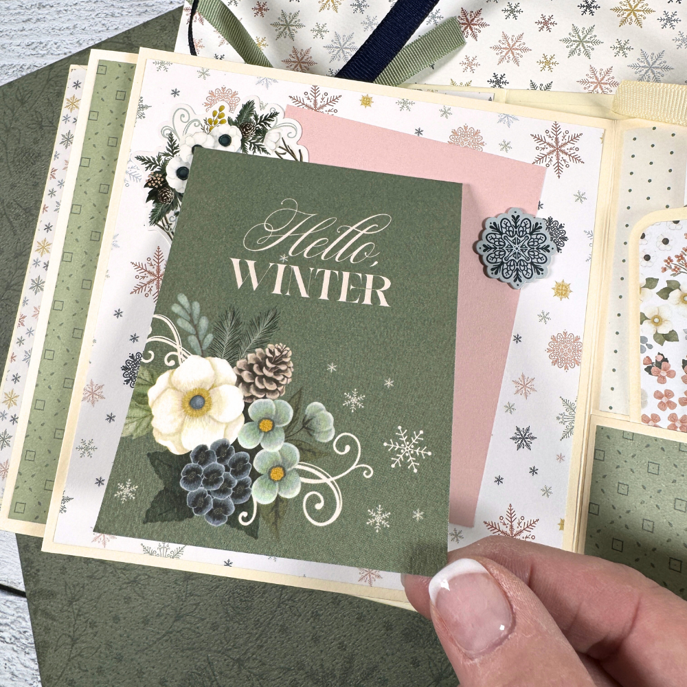 Let It Snow Scrapbook Album page with a folding card, snowflakes, flowers, and pine cones