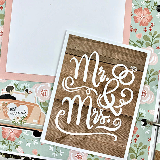 Our Wedding Day Scrapbook Album Page with lots of pretty flowers, a just married car, and woodgrain papers