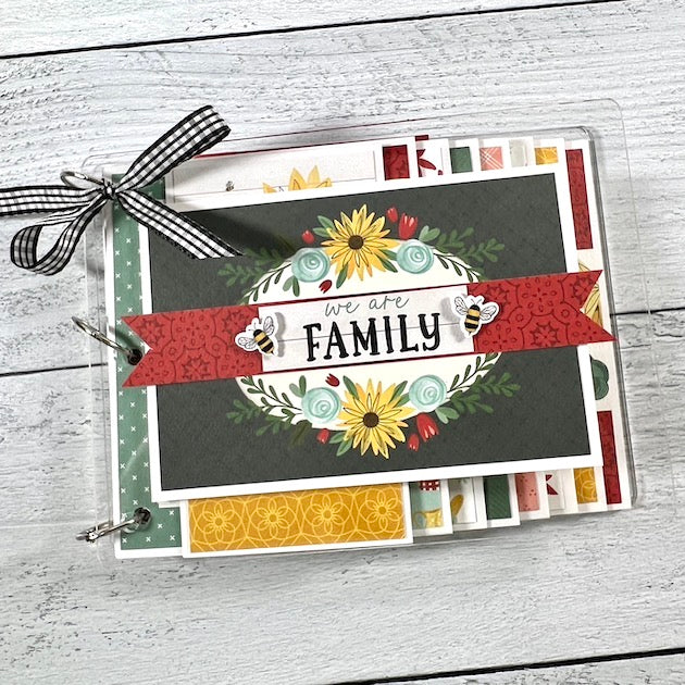 We Are Family clear acrylic waterfall scrapbook with flowers, pretty colors, and layered waterfall pages