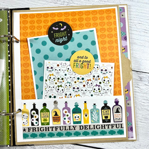Halloween scrapbook album page with a pocket, journaling cards, and potion bottles