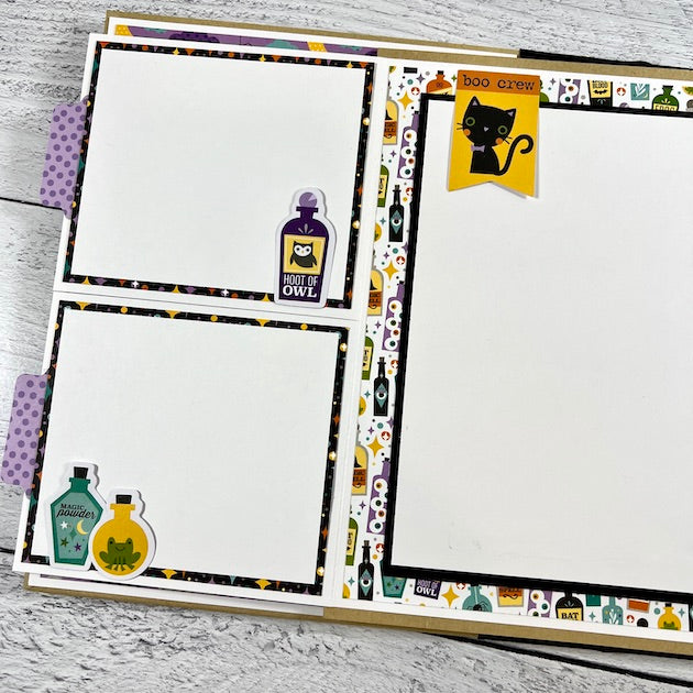 Halloween scrapbook album page with black cat and potion bottles