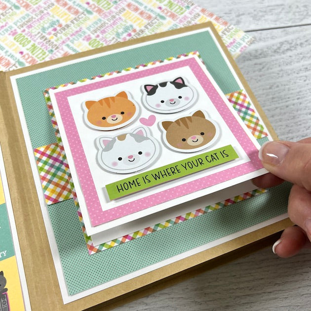 Cat scrapbook album page with 4 kitty faces and a folding element